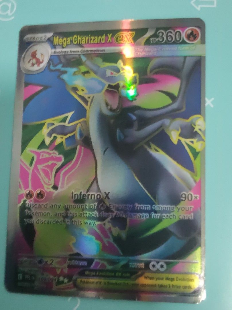 Mega Charizard X EX Pokemon Card (Category: Toys & Games) located in Kuala Lumpur. Submitted by mars_card123 (Listing ID 1448935333, Image 1). Description: - Mega Charizard X EX Pokemon Card - 360 HP - Inferno X Attack: 90 Damage - Essential for any Pokemon TCG collection - Powerful addition to your deck!.