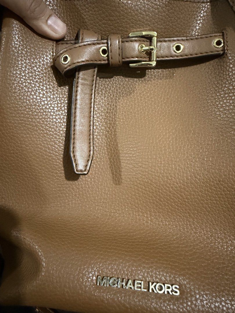 Michael Kors Emilia Bucket Bag (Category: Luxury Bags & Wallets) located in Makati City. Submitted by gkp14 (Listing ID 1449020256, Image 3). Description: - Brand: Michael Kors - Material: Brown pebbled leather - Style: Bucket bag - Strap: Adjustable crossbody strap - Hardware: Gold details - Ideal for: Everyday use.
