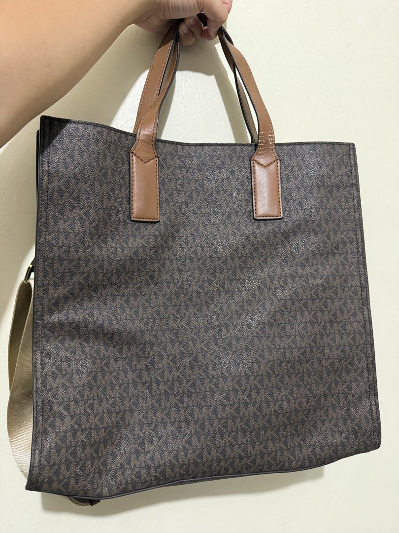Michael Kors Kenly Tote Bag with Strap (Category: Luxury Bags & Wallets) located in Makati City. Submitted by gkp14 (Listing ID 1449020859, Image 2). Description: - Authentic Michael Kors tote bag - Classic brown MK monogram print - Tan leather trim and handles - Gold hardware details - Front zip pocket for easy access - Spacious interior for daily essentials - Includes a detachable crossbody strap.