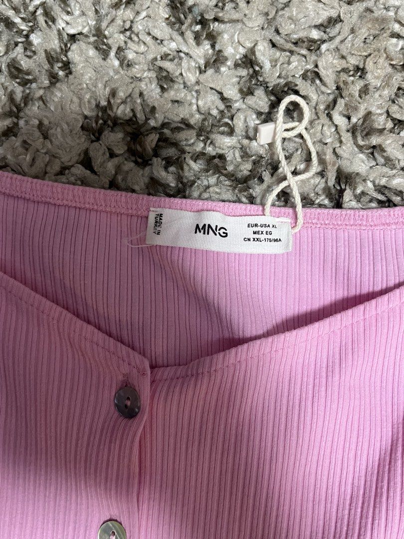 MNG Pink Ribbed Puff Sleeve Eyelet Top (Category: Blouses) located in Pasay City. Submitted by losient (Listing ID 1449071685, Image 2). Description: - Pink ribbed top - Puff sleeves with eyelet details - Button-up front - Square neckline - Estimated size: XL.
