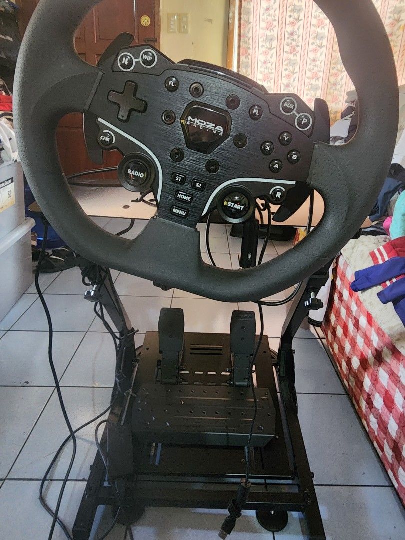 Moza Racing Wheel and Pedals with Stand (Category: Controllers) located in Caloocan City. Submitted by erreiv (Listing ID 1448990973, Image 2). Description: - Moza R3 Racing Wheel and Pedals for PC. > Complete set (with pit) (box and manual included) Less than a month used. (Pit bought separately worth 2500) - sturdy stand - All necessary cables included - Ready for your sim racing setup - Improves gaming experience - In good working condition.