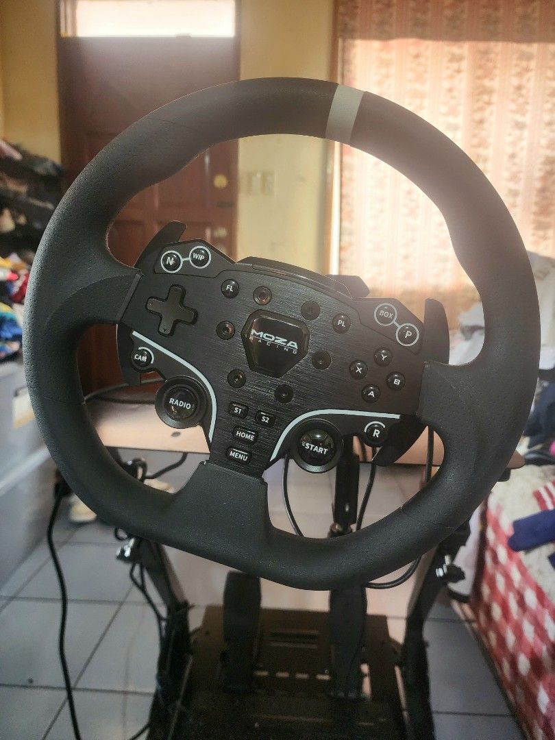 Moza Racing Wheel and Pedals with Stand (Category: Controllers) located in Caloocan City. Submitted by erreiv (Listing ID 1448990973, Image 1). Description: - Moza R3 Racing Wheel and Pedals for PC. > Complete set (with pit) (box and manual included) Less than a month used. (Pit bought separately worth 2500) - sturdy stand - All necessary cables included - Ready for your sim racing setup - Improves gaming experience - In good working condition.