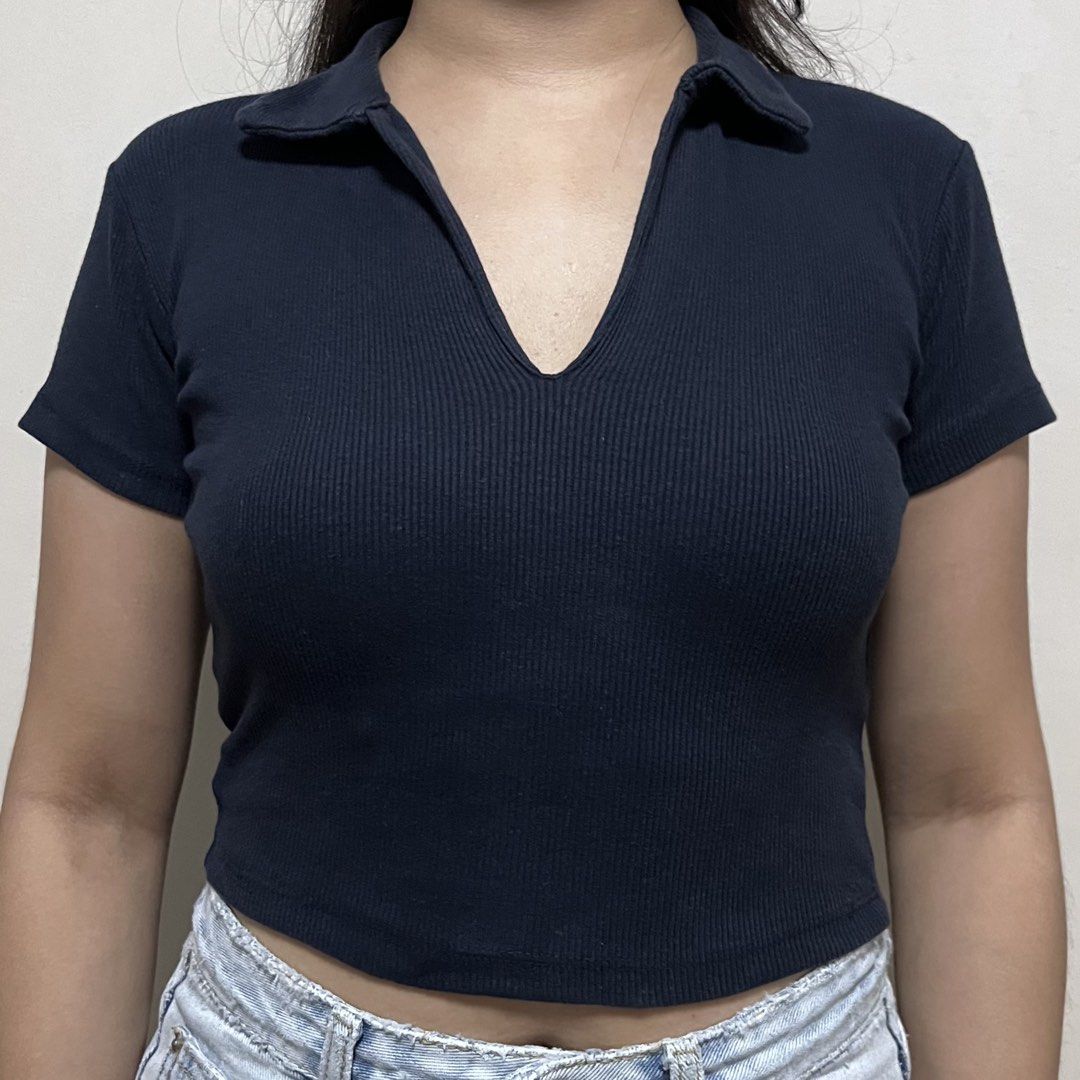Navy Blue Ribbed Cropped Polo Shirt (Category: Shirts) located in Iriga City. Submitted by _prelovedbymaris (Listing ID 1449077637, Image 1). Description: - Size: best firs xs-small - Navy blue cropped polo shirt - Ribbed texture all over - Short sleeves - Collar and V-neck design.