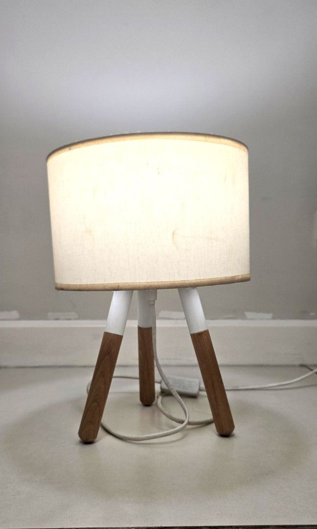 Nordic Desk Lamp Beige and White (Category: Lighting) located in Quezon City. Submitted by queentana_finds (Listing ID 1448989558, Image 3). Description: Lightly used. No damage. Nordic design,white and beige. No issues with bulb, photo provided in the album. 2 socket outlet, 220 v. Ikea-ish peg. Very aesthetic. Used this during pandemic when I was working from home. RFS: Declutter..