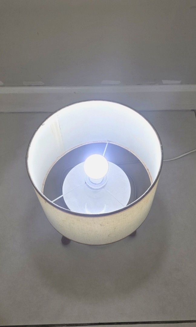 Nordic Desk Lamp Beige and White (Category: Lighting) located in Quezon City. Submitted by queentana_finds (Listing ID 1448989558, Image 2). Description: Lightly used. No damage. Nordic design,white and beige. No issues with bulb, photo provided in the album. 2 socket outlet, 220 v. Ikea-ish peg. Very aesthetic. Used this during pandemic when I was working from home. RFS: Declutter..