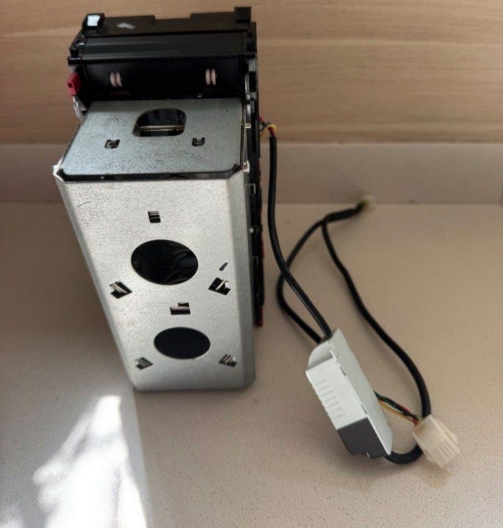 Note Validator/Acceptor MDB (Category: Other Electronics) located in Singapore. Submitted by HotClaw (Listing ID 1448957575, Image 3). Description: Used for 2yrs. Bought For $500, selling at $170 FAST DEAL! ✅️ Well Maintained and Tested before listing ✅️ Can be used for Claw Machine/all types of Vending Machines ✅️ Accepts $2, $5, $10 Notes ✅️ Able to detect & reject Fake notes! ✅️ Cheapest in the market! ✅️ Free Delivery!.