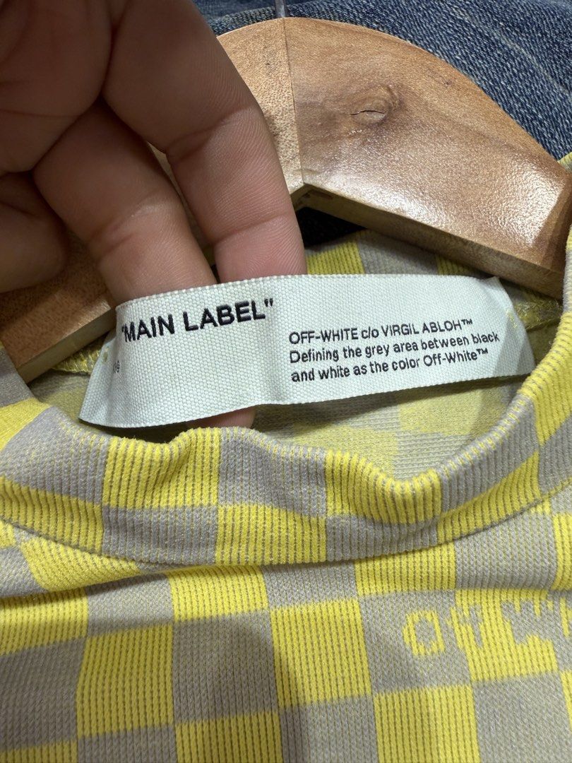 Offwhite (Category: Longsleeves) located in Quezon City. Submitted by macleen17 (Listing ID 1449034623, Image 3). Description: Off-White™ Bubble Check Long Sleeve T-Shirt. Released as part of the brand’s Fall/Winter 2019 “His & Hers” runway collection, it features a distinct yellow and grey optical checkered pattern that creates a “bubble” distortion effect across the body. -Mock neck collar, slim form-fitting silhouette, and fine rib-knit cuffs.