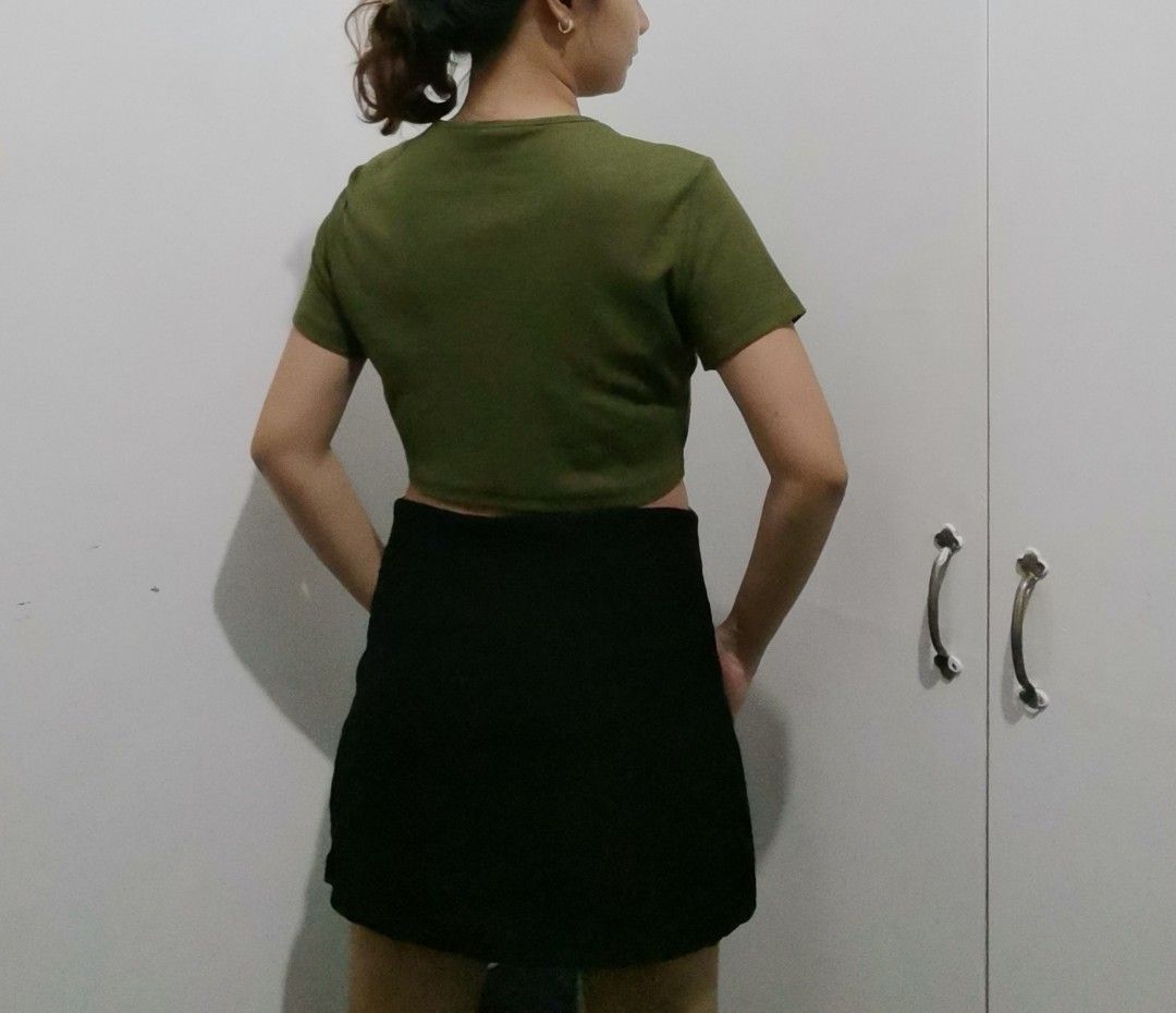 Olive Green Cropped T-Shirt (Category: Shirts) located in Manila. Submitted by fiopicks (Listing ID 1449043557, Image 2). Description: - Basic olive green cropped t-shirt - Short sleeves and crew neck - Stretchy material for comfort - Pairs perfectly with high-waisted bottoms - Ideal for casual everyday wear - Fits like a size Small (S).