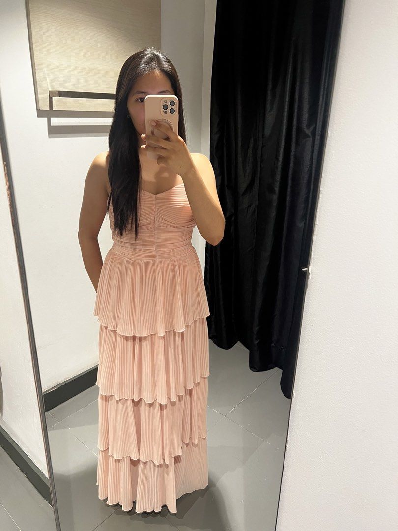 Pleated Peach Floor Length Dress (Category: Dresses) located in Bacoor. Submitted by thestufflab (Listing ID 1449102821, Image 3). Description: Brand: Viola Dress Bought from SM Department Store - MOA -with tag - with zipper at the back - with black ribbon accessories Display Photo Height 5’2 inches Amount : PHP 3,500.00 Never been used Meetup : SM Bacoor Delivery : J&T.