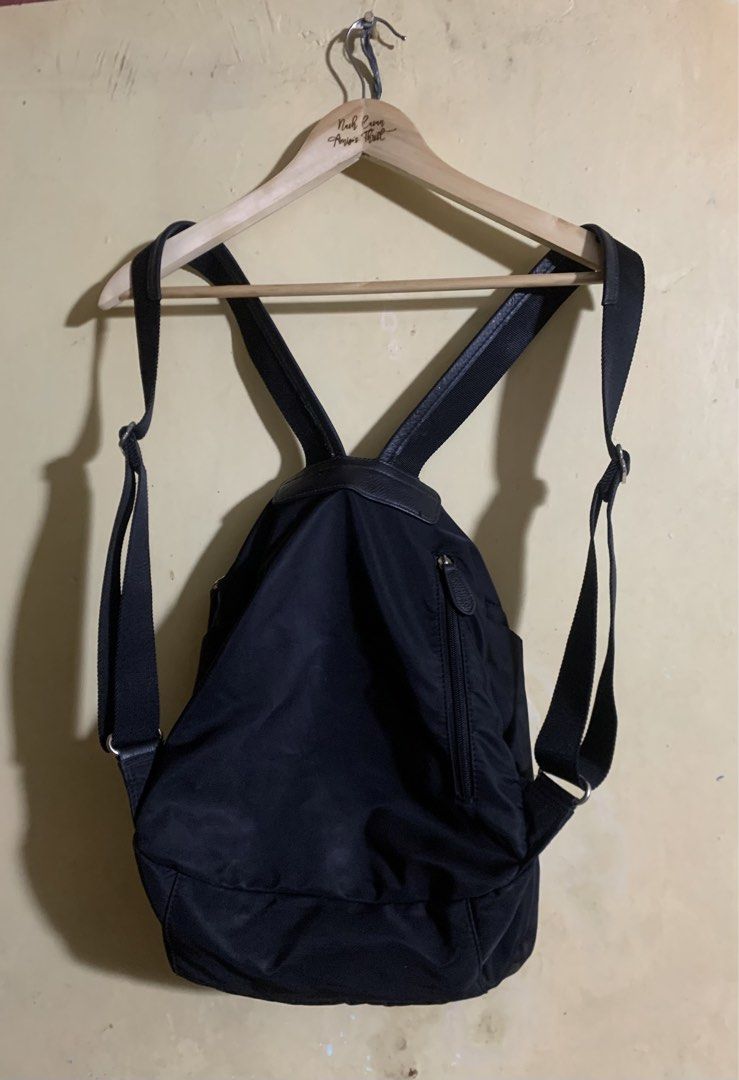 Prada Nylon Backpack (Category: Luxury Bags & Wallets) located in Legazpi City. Submitted by casanibrah33153 (Listing ID 1449042617, Image 2). Description: - Prada backpack - Black nylon material - Leather handle and straps - Main compartment with zip closure - Interior zip pocket - Ideal for everyday use.