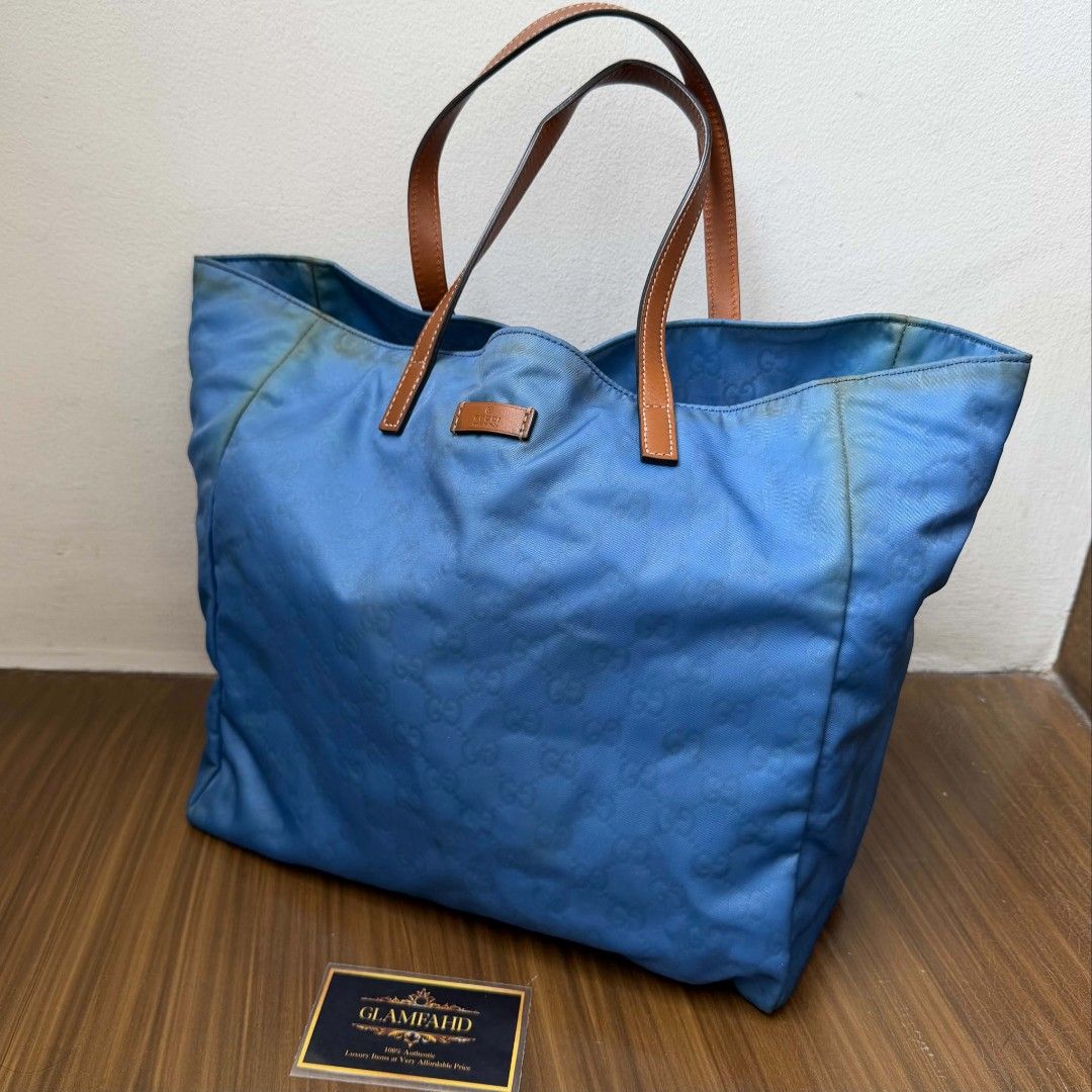 Pre Owned Authentic GUCCI GG Nylon Tote Bag (Category: Luxury Bags & Wallets) located in Paranaque City. Submitted by Glamfahd (Listing ID 1448948052, Image 2). Description: Pre Owned Authentic GUCCI Bag Inclusion/s: None Condition Well Used condition Marks on exterior Marks on interior Bag is really a great buy! Please manage your expectations as you are buying an authentic second hand item at a fraction of the cost.