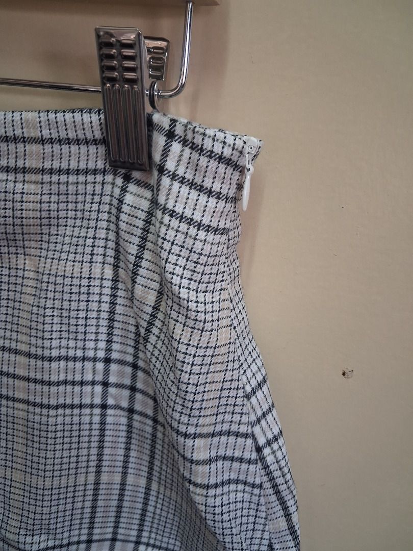 Preloved Cotton ON skirt (Category: Skirts) located in Muntinlupa City. Submitted by mitchnt (Listing ID 1448911040, Image 3). Description: RFS: no longer fits me Size: Medium on tag - Cute plaid mini skirt - Side zipper closure - Black, white, and beige color mix - Versatile for casual or dressed-up outfits - Easy to style with various tops and shoes disclaimer: item is cross-posted from another platform.