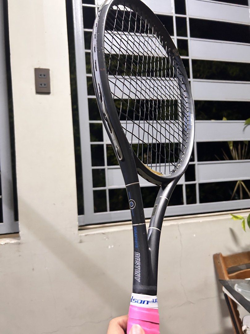Pro Kennex Graphite Destiny Tennis Racket (Category: Racket and Ball Sports) located in Binan City. Submitted by bellashops (Listing ID 1449078342, Image 3). Description: - Pro Kennex Graphite Destiny tennis racket - New pink grip - Some scuffs on frame and head - Ready for the court - Great for practice or casual play.