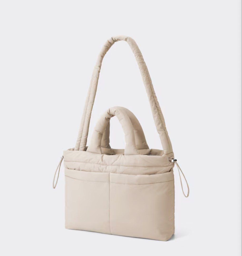 Puff Drawstring Shoulder Bag (Category: Tote Bags) located in Quezon City. Submitted by jong_17 (Listing ID 1449019286, Image 2). Description: Details - Convenient inner pocket and inner compartment with hook-and-loop fastener. - Plenty of storage space. - Magnetic button for easy access. Size Height: 30cm, Width (Bottom): 40cm, Depth: 9cm, Handle Length: 13cm, Shoulder Strap Length: ~120cm,.