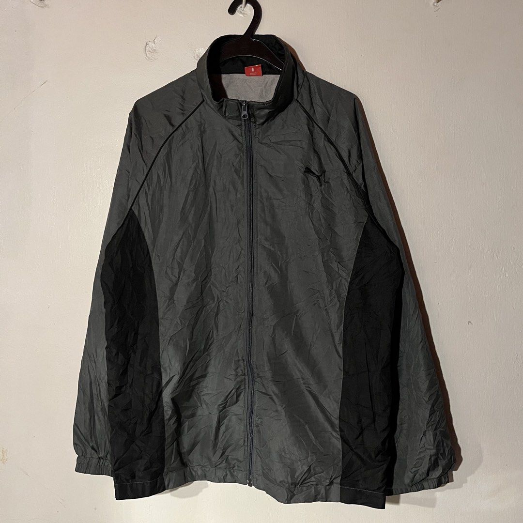 Puma | Gray Windbreaker with Black Stripes (Category: Coats, Jackets and Outerwear) located in Quezon City. Submitted by giometryyy (Listing ID 1449102671, Image 1). Description: W23 L28 Large excellent condition embroidered logo with two side pockets 📍Fairview, QC 🛵Lalamove/J&T payment first .