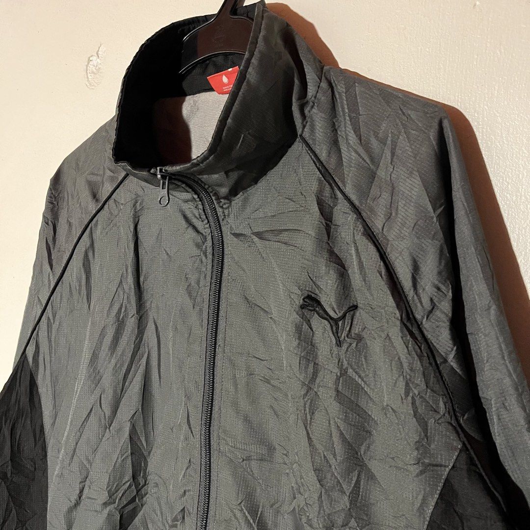 Puma | Gray Windbreaker with Black Stripes (Category: Coats, Jackets and Outerwear) located in Quezon City. Submitted by giometryyy (Listing ID 1449102671, Image 2). Description: W23 L28 Large excellent condition embroidered logo with two side pockets 📍Fairview, QC 🛵Lalamove/J&T payment first .
