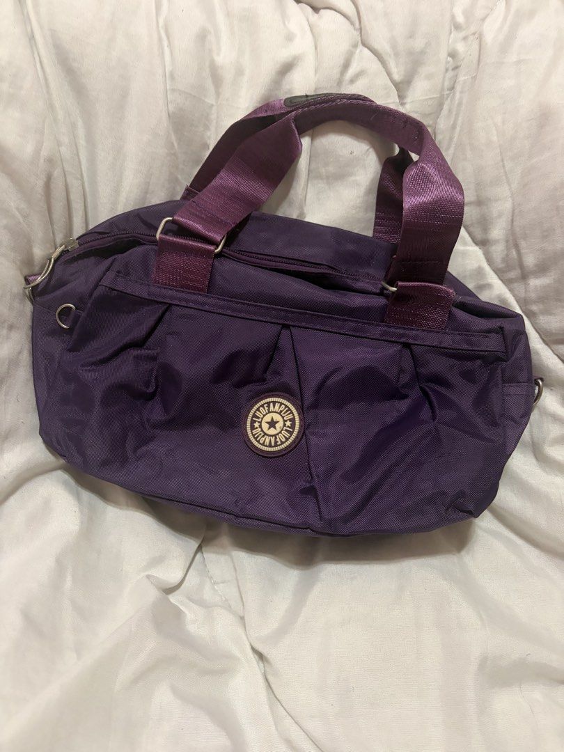 Purple Nylon Shoulder Bag with Top Handles (Category: Luxury Bags & Wallets) located in Malabon City. Submitted by pbjsandowichi (Listing ID 1448926082, Image 1). Description: Mod: J&T, Lalamove Mop: Gcash, Gotyme, Maribank delivery fee will be shouldered by the buyer .