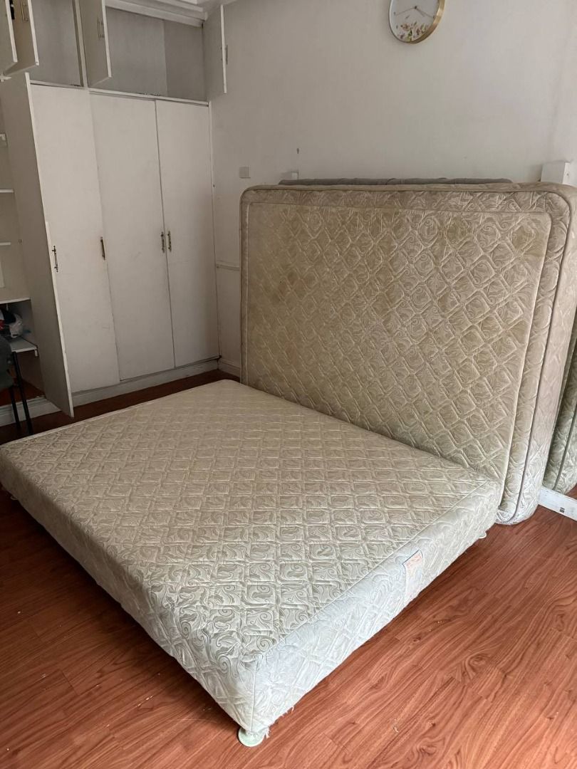 Queen Size Bed Set with Mattress, Divan Base (Category: Bed Frames & Mattresses) located in Pasig City. Submitted by rctaneo24 (Listing ID 1449026261, Image 2). Description: Queen-size bed set for sale, including mattress, upholstered divan base. Sturdy and comfortable, ideal for a master bedroom, condo, rental unit, or guest room. Well used with visible signs of wear and discoloration; please check all photos. Cleaning is recommended. Buyer to a