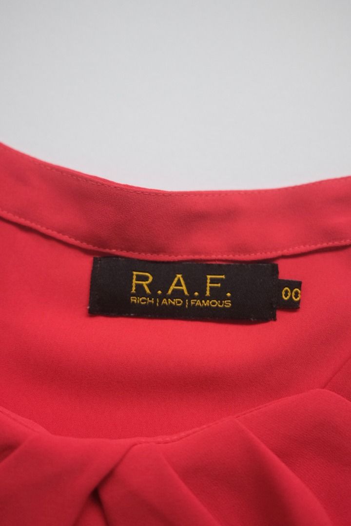 R.A.F. Red Sleeveless Top (Category: Sleeveless) located in Naga. Submitted by billysstuff (Listing ID 1448995891, Image 2). Description: - Sleeveless top from R.A.F. Rich and Famous - Features a gathered detail at the front neckline - Simple and chic design - Perfect for dressing up or down.