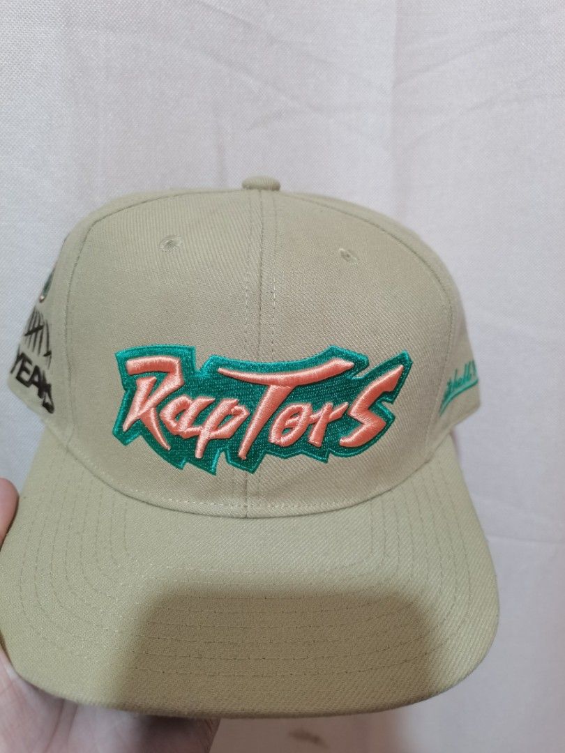 Rare Retro Toronto Raptors Mitchell and Ness Cap (Category: Caps & Hats) located in General Santos City (Dadiangas). Submitted by capitenyo (Listing ID 1449103129, Image 1). Description: Original Mitchell and Ness Cap - Retro / Old Realeased - With Side Hit Design - Flat Brim/Visor - Square Brim/Visor - Teal Green Under Visor Size - 7 3/8 (Fitted) Materials - 100% Polyester Color rate - 10/10 rare color way, Matingkad pa kulay Condition - Used, G