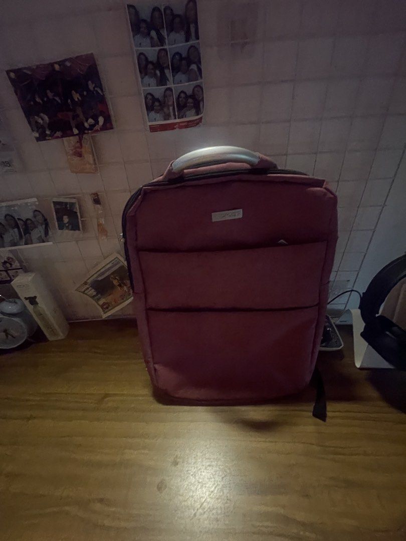 Red Backpack with Padded Compartments (Category: Backpacks) located in Manila. Submitted by grandfish_588f03 (Listing ID 1448973012, Image 2). Description: - Clean and stylish red backpack - Multiple zippered compartments on the front for easy access - Spacious main compartment with a padded section, ideal for a laptop - Adjustable shoulder straps for a comfortable fit - Sturdy top handle for alternative carrying - Great for daily use, school, or