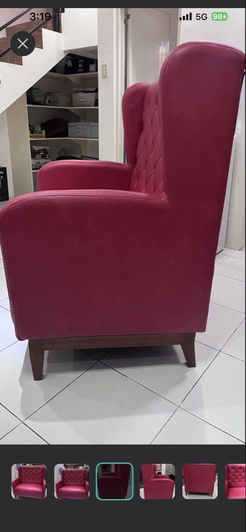 Red Tufted Wingback Sofa Chair (Category: Sofas) located in Cavite. Submitted by z3113 (Listing ID 1448972609, Image 2). Description: - Classic red armchair with elegant tufted backrest. - Shiny red upholstery for a striking look. - Sturdy wooden legs for support. - Ideal as a statement accent piece for any room. - Approximately 2 feet wide..