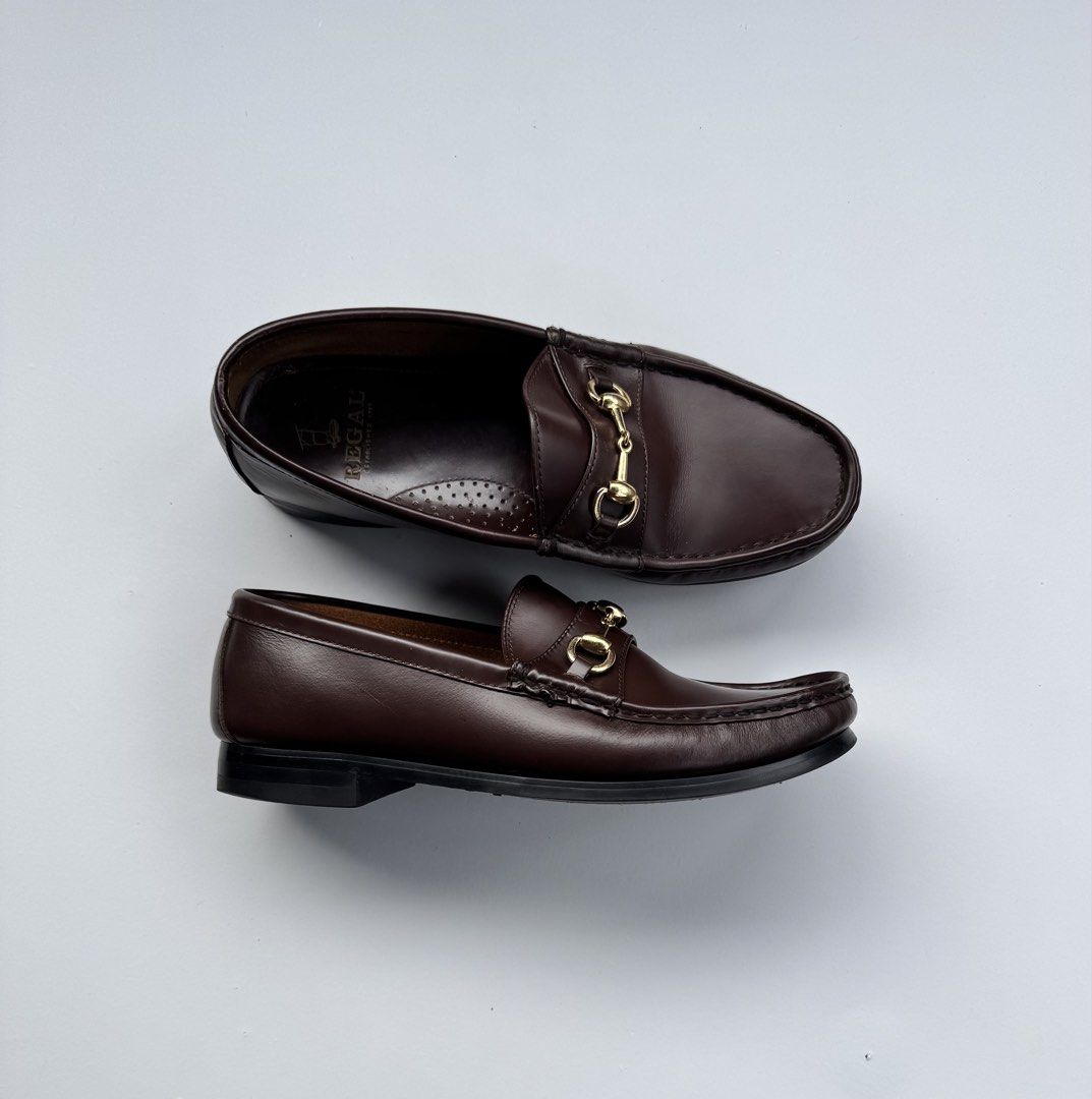 Regal Brown Leather Horsebit Loafers (Category: Dress Shoes) located in Davao. Submitted by LUXURY (Listing ID 1449049197, Image 1). Description: Regal Classic brown leather loafers with gold horsebit detail. Slip-on style, perfect for any outfit. Size 8 mens Pair only Visit my profile for more luxury items .