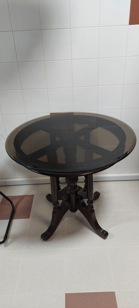 Round Dark Wood Dining Table with Ornate Base