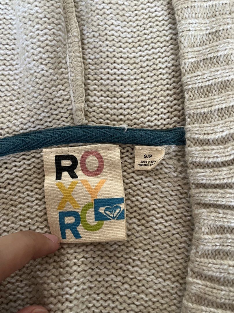Roxy Y2k Hoodie Knit Sweater (Category: Coats, Jackets and Outerwear) located in Muntinlupa City. Submitted by ysabeb (Listing ID 1449010068, Image 3). Description: -roxy y2k vintage knit v neck hooded sweater with embroidered logo -off white/cream kinda color -comfy and aesthetic -worn once but in very good condition -no when worn pics .