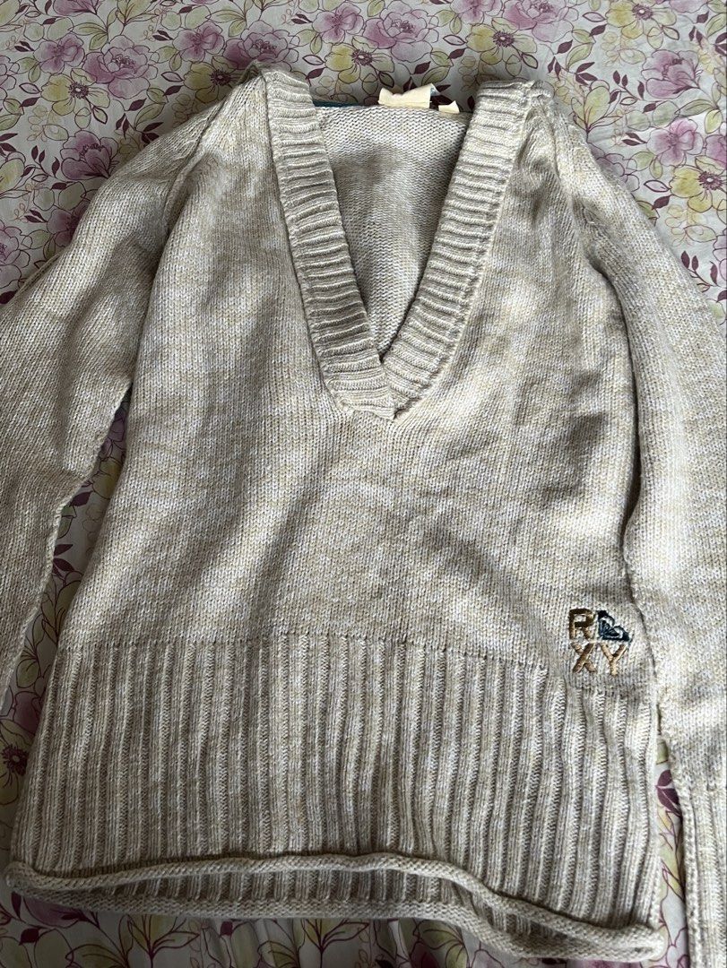 Roxy Y2k Hoodie Knit Sweater (Category: Coats, Jackets and Outerwear) located in Muntinlupa City. Submitted by ysabeb (Listing ID 1449010068, Image 1). Description: -roxy y2k vintage knit v neck hooded sweater with embroidered logo -off white/cream kinda color -comfy and aesthetic -worn once but in very good condition -no when worn pics .