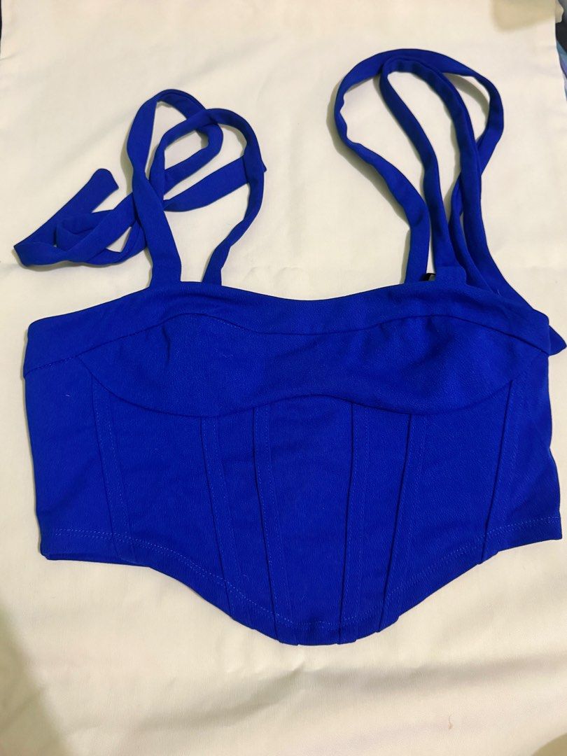 Royal Blue Corset Top with Tie Straps (Category: Sleeveless) located in Meycauayan. Submitted by jamclos.et (Listing ID 1449067346, Image 1). Description: - Super cute royal blue corset top - Adjustable tie straps for versatile styling - Boning for a flattering, shaped silhouette - Soft and stretchy material for comfort - Perfect for dressing up or down - Looks amazing with jeans or skirts.