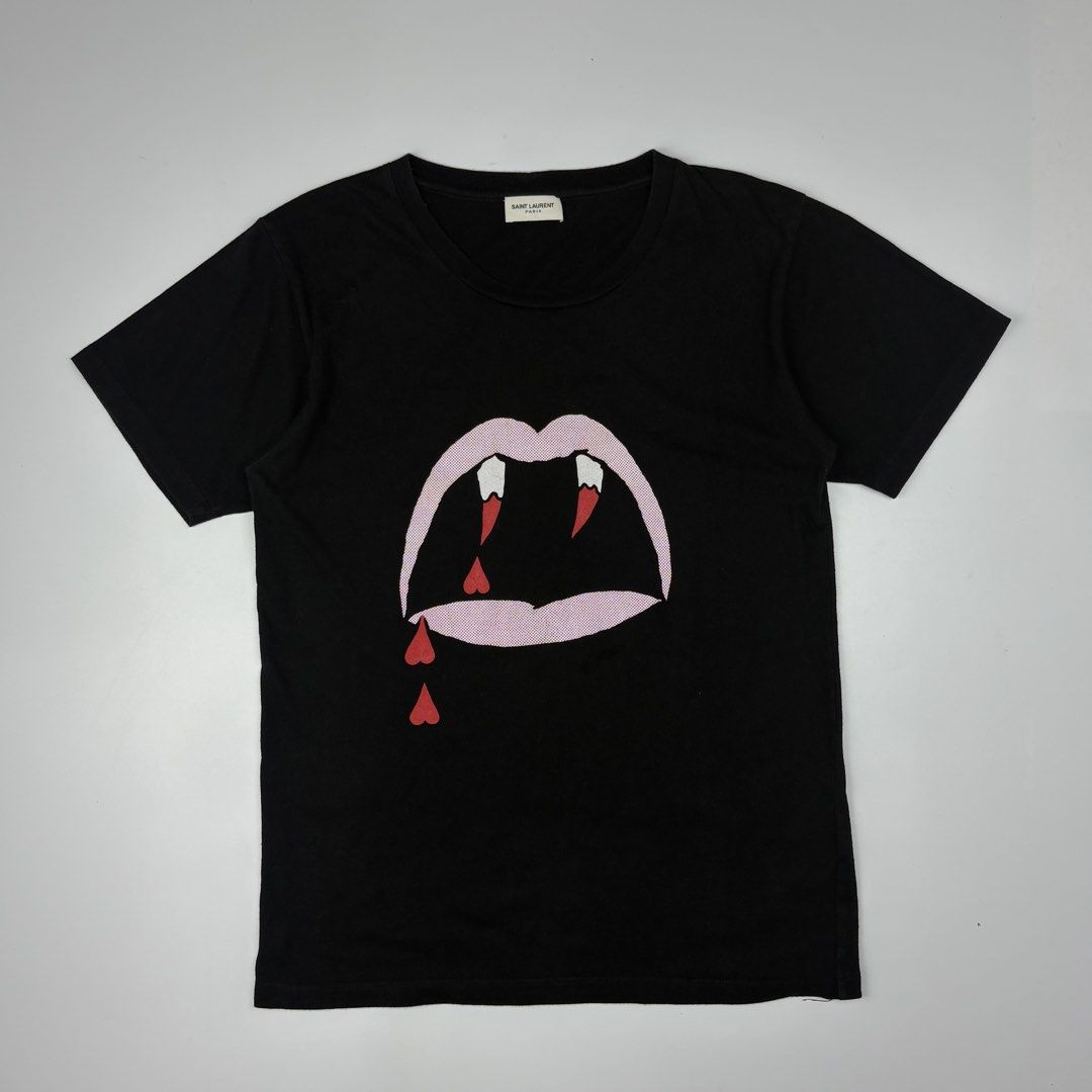 Saint Laurent - Hedi Slimane - Blood Luster Tshirt (Category: Luxury Apparel) located in Bacolod City. Submitted by cast.archives (Listing ID 1449072580, Image 1). Description: Saint Laurent - Hedi Slimane - Blood Luster Tshirt Size: Small Condition: Very good Flaw: Cut wash tag.