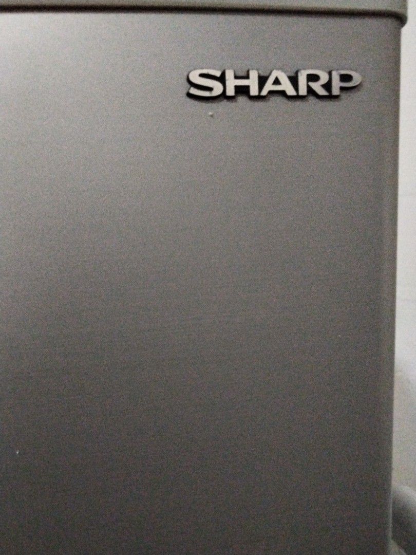 Sharp Refrigerator (Category: Refrigerators & Freezers) located in Singapore. Submitted by safedolphin.f2fe72 (Listing ID 1449059986, Image 1). Description: - Sharp refrigerator with top freezer - Still cools effectively - Ideal for dorm rooms or small apartments.