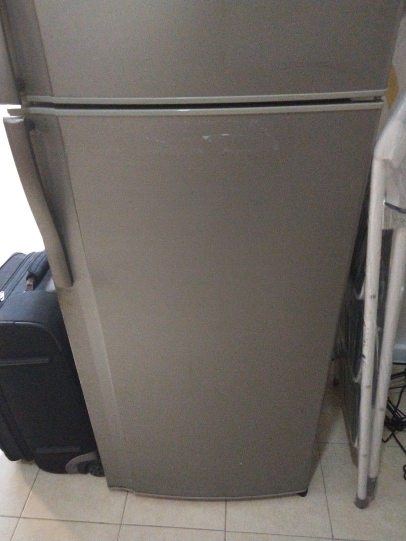 Sharp Refrigerator (Category: Refrigerators & Freezers) located in Singapore. Submitted by safedolphin.f2fe72 (Listing ID 1449059986, Image 3). Description: - Sharp refrigerator with top freezer - Still cools effectively - Ideal for dorm rooms or small apartments.