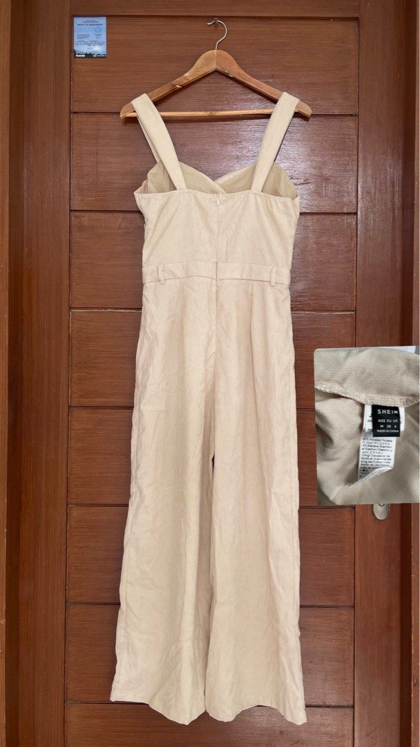 SHEIN Beige Wide Leg Jumpsuit (Category: Jumpsuits) located in Manila. Submitted by coollion_7aaba1 (Listing ID 1449085414, Image 2). Description: - Beige wide leg jumpsuit from SHEIN - Sweetheart neckline with ruched detail - Adjustable straps for a perfect fit - Never used .
