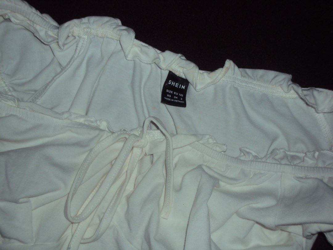 SHEIN White Off-Shoulder Tie Front Crop Top (Category: Blouses) located in Candon. Submitted by czaeya (Listing ID 1449007290, Image 3). Description: ♡ color: white ♡ Features a tie front detail ♡ ask for more pics if interested! (: .