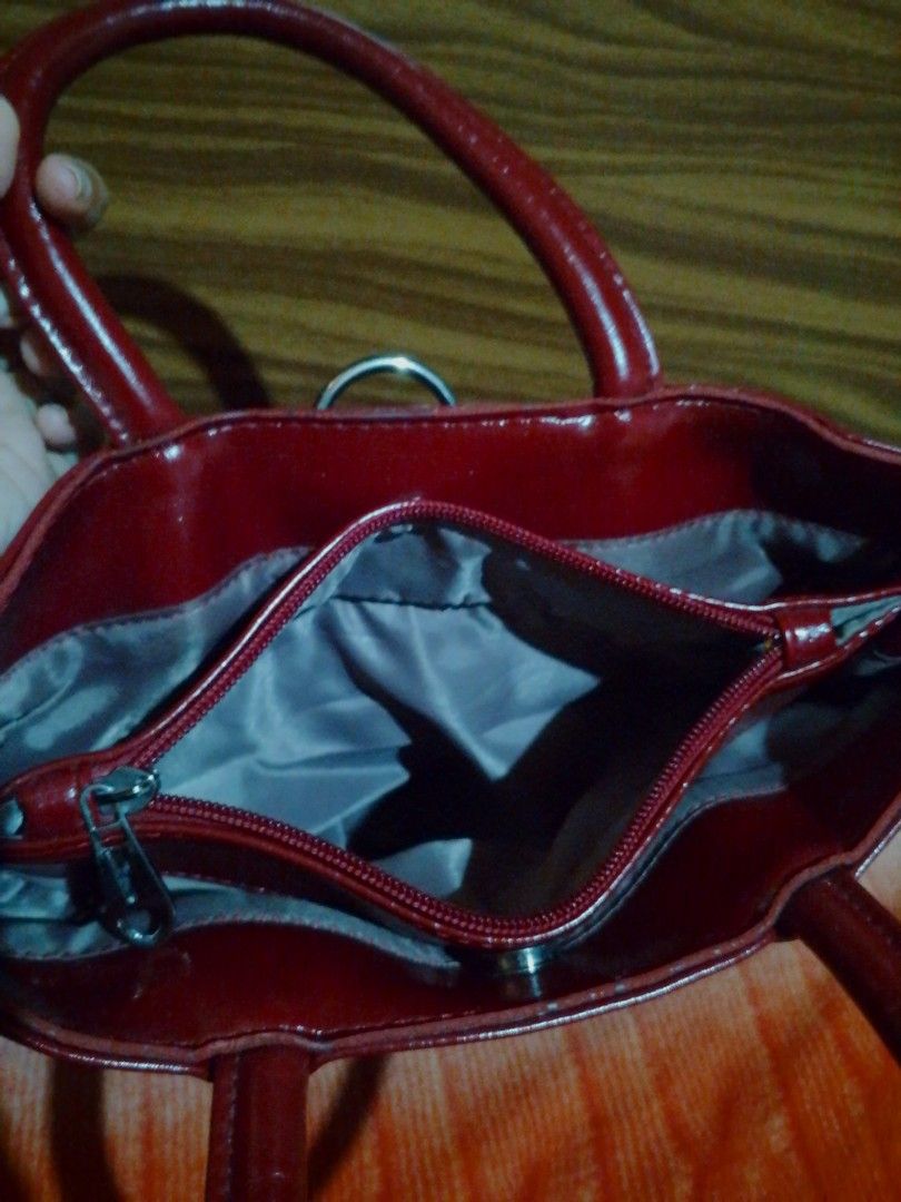 Shiny Red Handbag with Zipper Compartment (Category: Luxury Bags & Wallets) located in Caloocan City. Submitted by cleverrabbit (Listing ID 1448913024, Image 3). Description: - Red patent leather handbag - Main zipper compartment inside - Sturdy top handles - Clean interior - Perfect for everyday use (big).