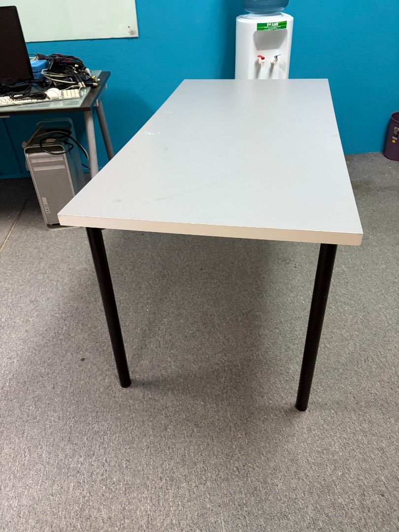 Simple Rectangular Table with Black Legs (Category: Tables & Sets) located in Singapore. Submitted by cleverforest.b5657c (Listing ID 1448976992, Image 2). Description: - Plain rectangular table - Light grey tabletop - Sturdy black metal legs - Ideal for computer, laptop, study desk or simple dining - Flat and clean surface - Easy to move legs can be removed for easy transport - Dimensions: Approx. 150cm (L) x 70cm (W) x 74cm (H).