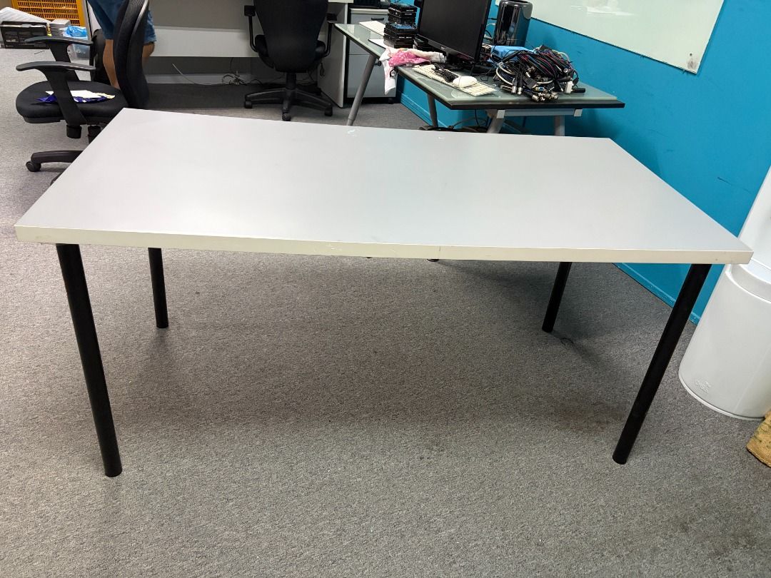 Simple Rectangular Table with Black Legs (Category: Tables & Sets) located in Singapore. Submitted by cleverforest.b5657c (Listing ID 1448976992, Image 3). Description: - Plain rectangular table - Light grey tabletop - Sturdy black metal legs - Ideal for computer, laptop, study desk or simple dining - Flat and clean surface - Easy to move legs can be removed for easy transport - Dimensions: Approx. 150cm (L) x 70cm (W) x 74cm (H).