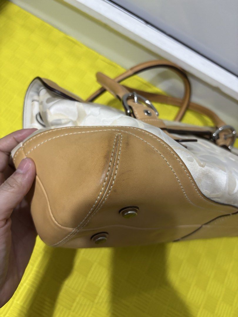 Soho Flap Satchel (Style Number 6722) (Category: Luxury Bags & Wallets) located in Malabon City. Submitted by thriftymanoy (Listing ID 1449022136, Image 3). Description: - Classic Coach monogram canvas shoulder bag - Tan leather trim and handles - Silver hardware details - Minor signs of wear on leather trim and bottom corners - Interior is clean - A timeless Coach accessory - with pen marks as shown - some dirt at the bottom - hardware is still 