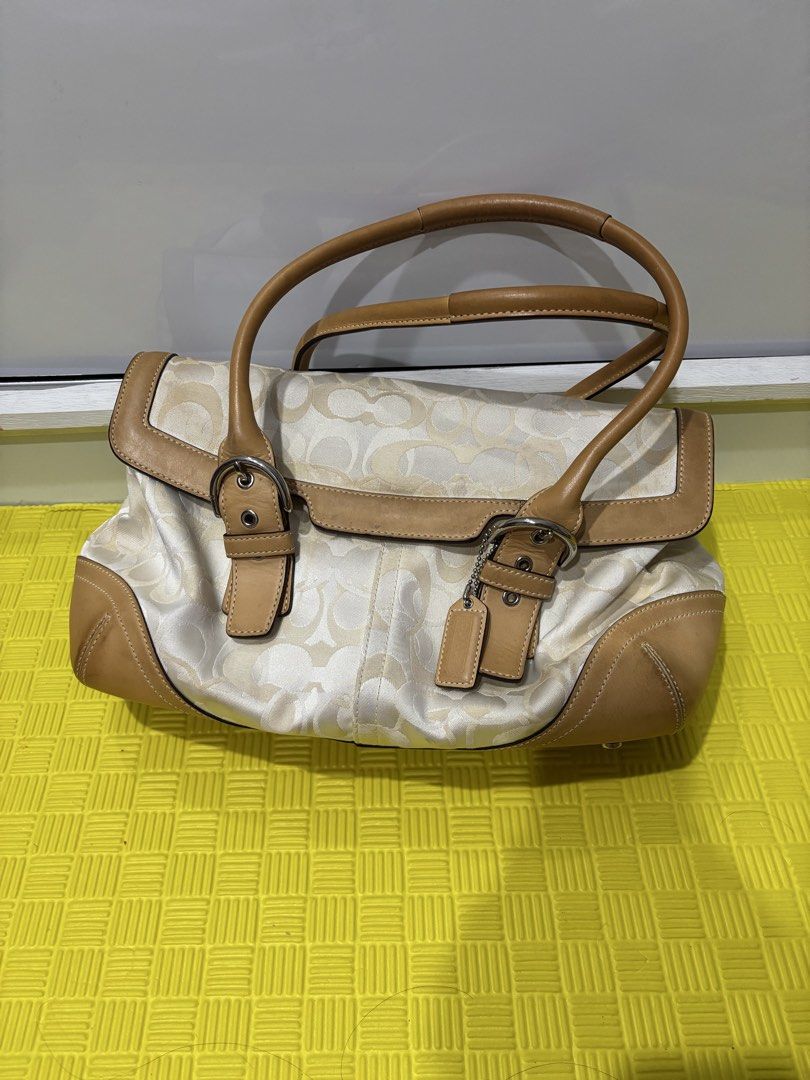Soho Flap Satchel (Style Number 6722) (Category: Luxury Bags & Wallets) located in Malabon City. Submitted by thriftymanoy (Listing ID 1449022136, Image 1). Description: - Classic Coach monogram canvas shoulder bag - Tan leather trim and handles - Silver hardware details - Minor signs of wear on leather trim and bottom corners - Interior is clean - A timeless Coach accessory - with pen marks as shown - some dirt at the bottom - hardware is still 