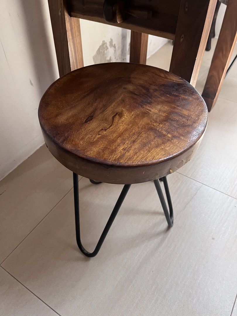 Solid Wood Round Stool with Metal Legs (Category: Chairs) located in Carmona. Submitted by thomasadviento (Listing ID 1448931380, Image 2). Description: - Round solid wood top with attractive grain - 100x60x78cm - Sturdy black metal hairpin legs - Versatile: use as a side table or extra seating - Complements rustic and modern decor styles - Approximately 18 inches tall - Please check photos for detailed condition.