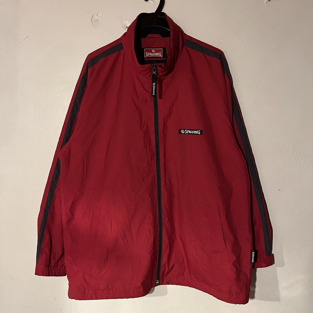 Spalding Red Track Jacket with Black Stripes (Category: Coats, Jackets and Outerwear) located in Quezon City. Submitted by giometryyy (Listing ID 1449102253, Image 1). Description: W24 L28.5 XL-2XL with packable hood with 4 inner chest pockets excellent condition needs wash 📍Fairview, QC 🛵Lalamove/J&T payment first .