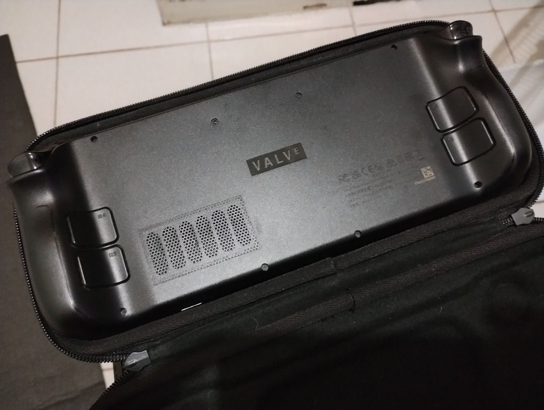 Steam Deck LCD 1TB (Category: Others) located in Quezon City. Submitted by mrgoodgears (Listing ID 1449010787, Image 2). Description: Still in very good condition. Yung issue lang dito yung isang screw hole sa back shell (loose thread na). Yun lang. Originally 64GB to, na-upgrade ko na sa 1TB. Corsair yung bagong ssd na pinalit ko. May screen protector at dust filters since day one. Wala rin tong hardware mods. SSD lang ang pinalitan dito. Inclus