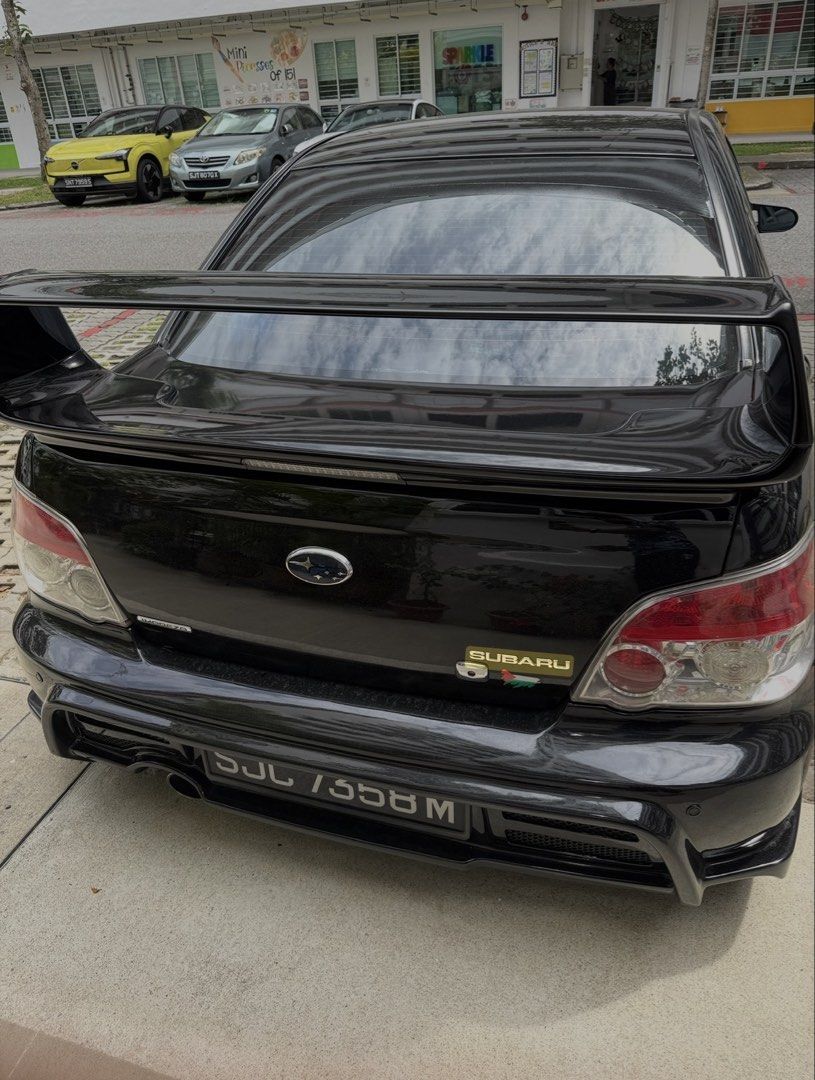 Subaru Impreza Impreza 4AT Auto (Category: Used Cars) located in Singapore. Submitted by the_don_king (Listing ID 1448957290, Image 3). Description: Black Subaru Impreza WRX STI. Gold rims. Sporty spoiler. Looks aggressive. Great for enthusiasts. Well maintained. Ready for a new owner. Contact me for more details. COE left 1 year 6 months.