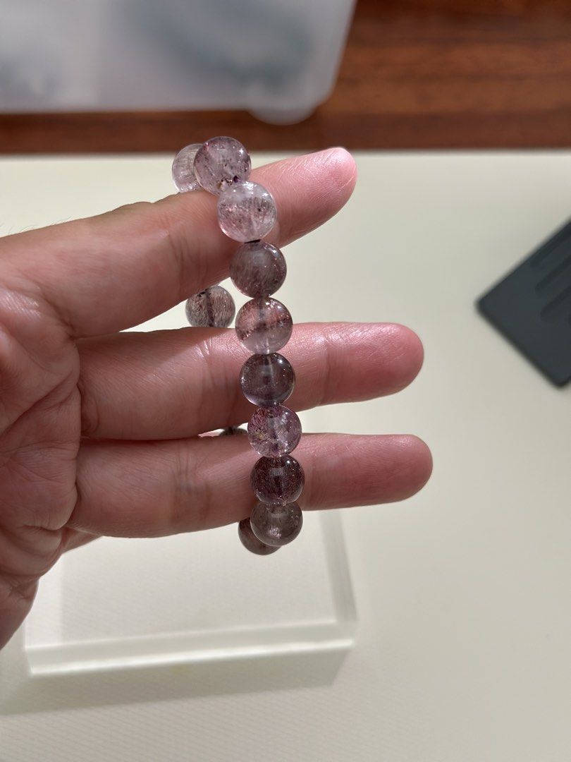 Super 7 Crystal Bracelet (Category: Bracelets) located in Kuala Lumpur. Submitted by joeyee85 (Listing ID 1448970003, Image 3). Description: - Beautiful Super 7 crystal bracelet - Natural stone beads with purple and red inclusions - Stretchy band for easy wear - Approximately 17cm in length - Ideal for everyday wear or as a thoughtful gift - A unique and special piece.