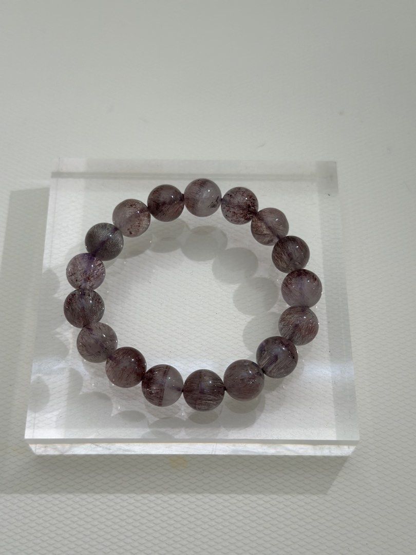 Super 7 Crystal Bracelet (Category: Bracelets) located in Kuala Lumpur. Submitted by joeyee85 (Listing ID 1448970003, Image 1). Description: - Beautiful Super 7 crystal bracelet - Natural stone beads with purple and red inclusions - Stretchy band for easy wear - Approximately 17cm in length - Ideal for everyday wear or as a thoughtful gift - A unique and special piece.