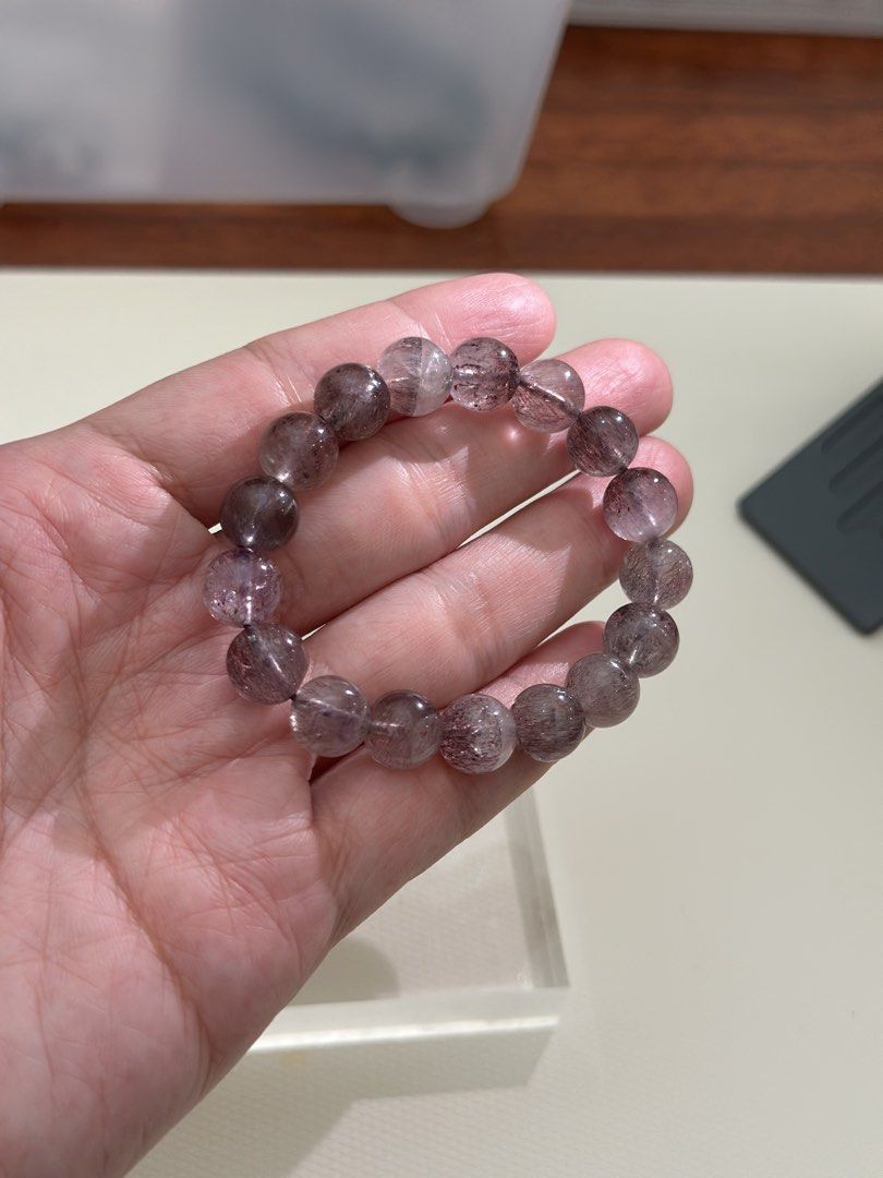 Super 7 Crystal Bracelet (Category: Bracelets) located in Kuala Lumpur. Submitted by joeyee85 (Listing ID 1448970003, Image 2). Description: - Beautiful Super 7 crystal bracelet - Natural stone beads with purple and red inclusions - Stretchy band for easy wear - Approximately 17cm in length - Ideal for everyday wear or as a thoughtful gift - A unique and special piece.