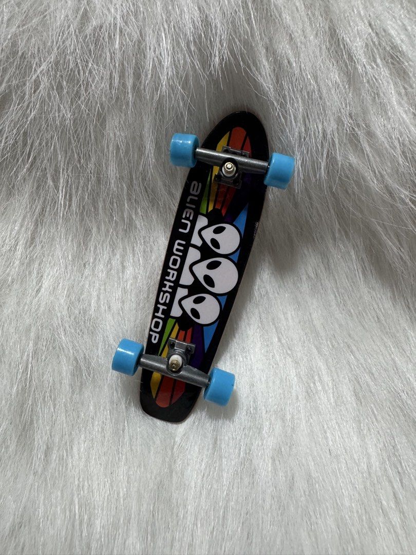 T1 Tech Deck fingerboard featuring an Alien Workshop Spectrum graphic (Category: Skates, Rollerblades & Scooters) located in Angeles City. Submitted by zyeplustradings (Listing ID 1449035159, Image 1). Description: Tech Deck fingerboard featuring an Alien Workshop Spectrum graphic It is designed in a longboard shape rather than a traditional skateboard shape. The deck features a rainbow “Spectrum” background with the Alien Workshop logo and brand