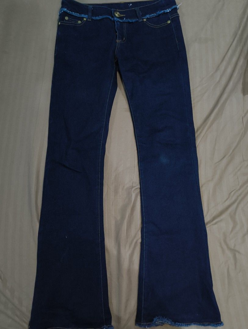 Tattered Dark Blue Low Waist Bootcut Jeans (Category: Jeans) located in Manila. Submitted by soapy_r (Listing ID 1448993205, Image 1). Description: size 27, length 38 item is thrifted & preloved, manage expectations must be fully paid before i ship out your order.